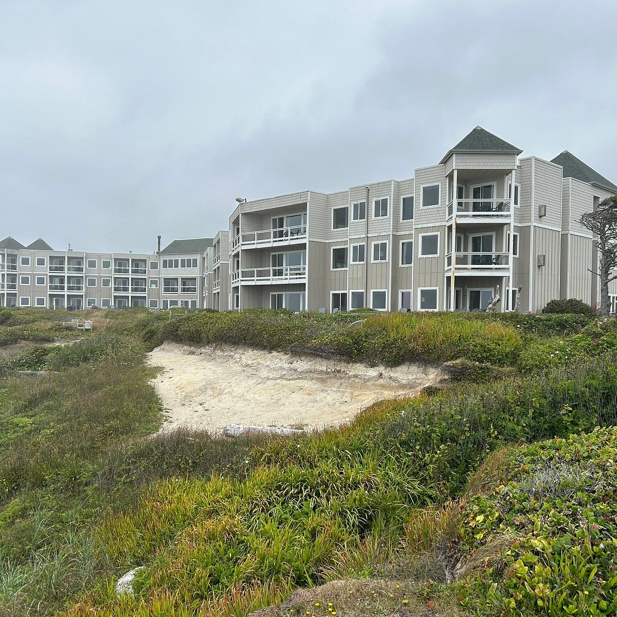 An exterior view of Overleaf Lodge and Spa on the Oregon Coast as seen from the beach.